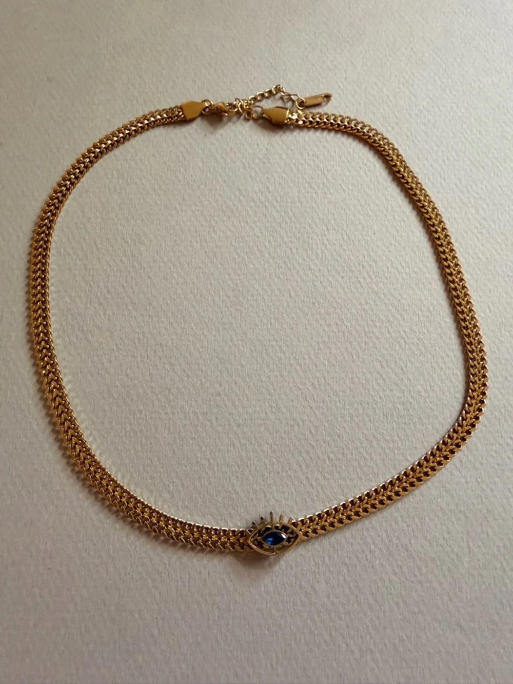 Sorel Gold Chain Choker with Blue Eye Charm